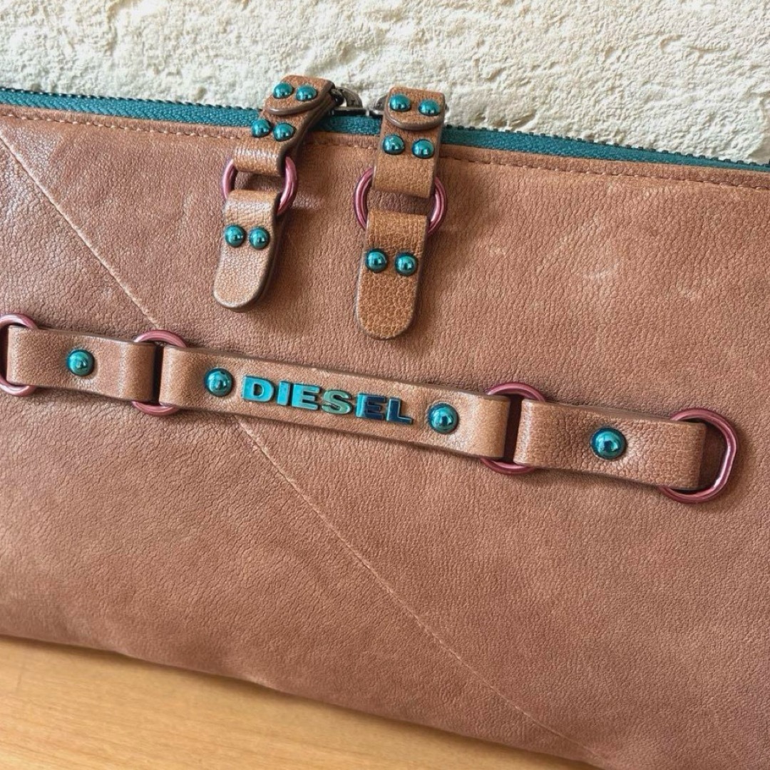 DIESEL - DIESEL 羊革クラッチバッグ ターコイズスタッズの通販 DIESEL - DIESEL 羊革クラッチバッグ ターコイズスタッズの通販