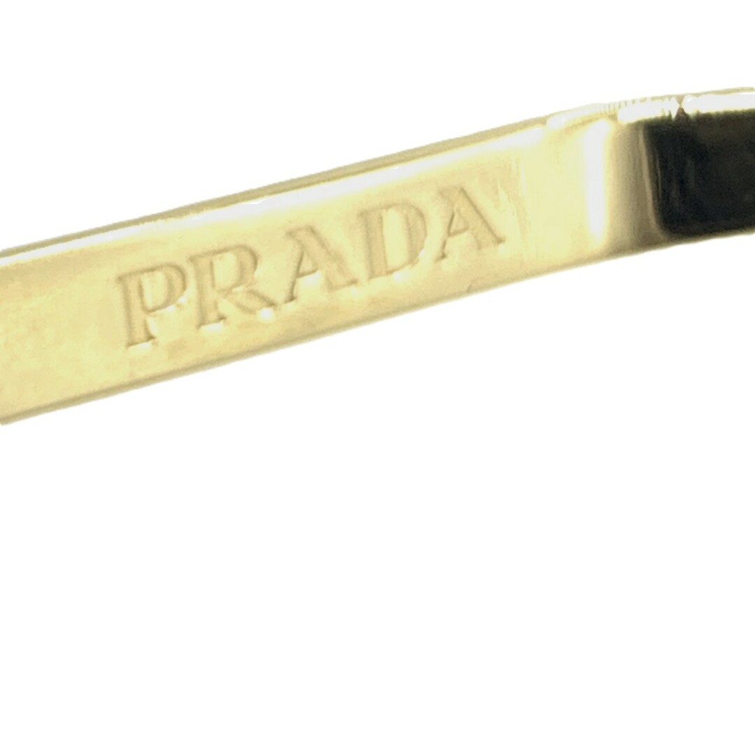 PRADA - プラダ トライアングルロゴ カチューシャ ゴールド系 PRADA - プラダ トライアングルロゴ カチューシャ ゴールド系