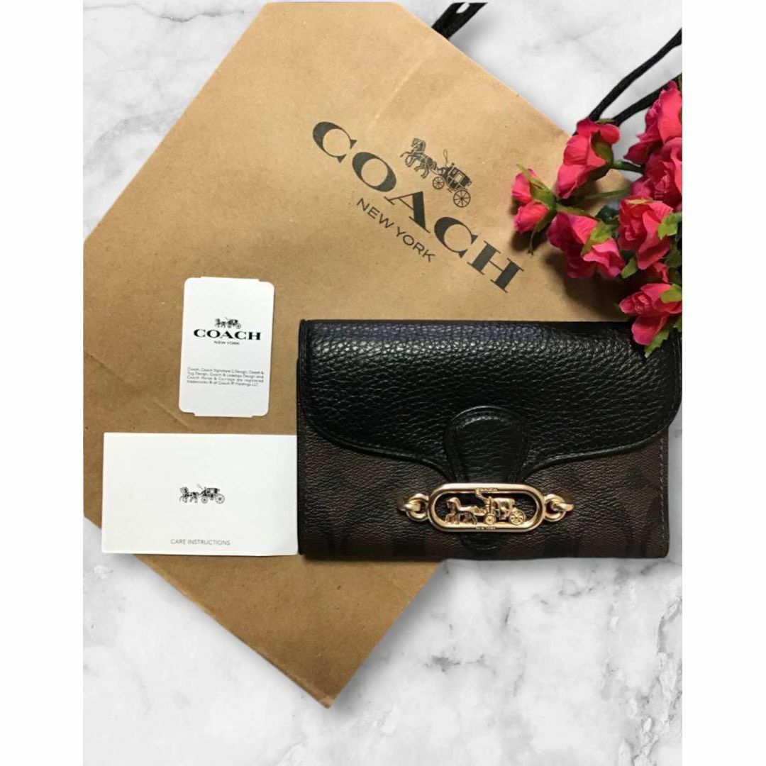 COACH - 新品 ショッパー付 COACH シグネチャー 柄 折財布の通販 COACH - 新品 ショッパー付 COACH シグネチャー 柄 折財布の通販