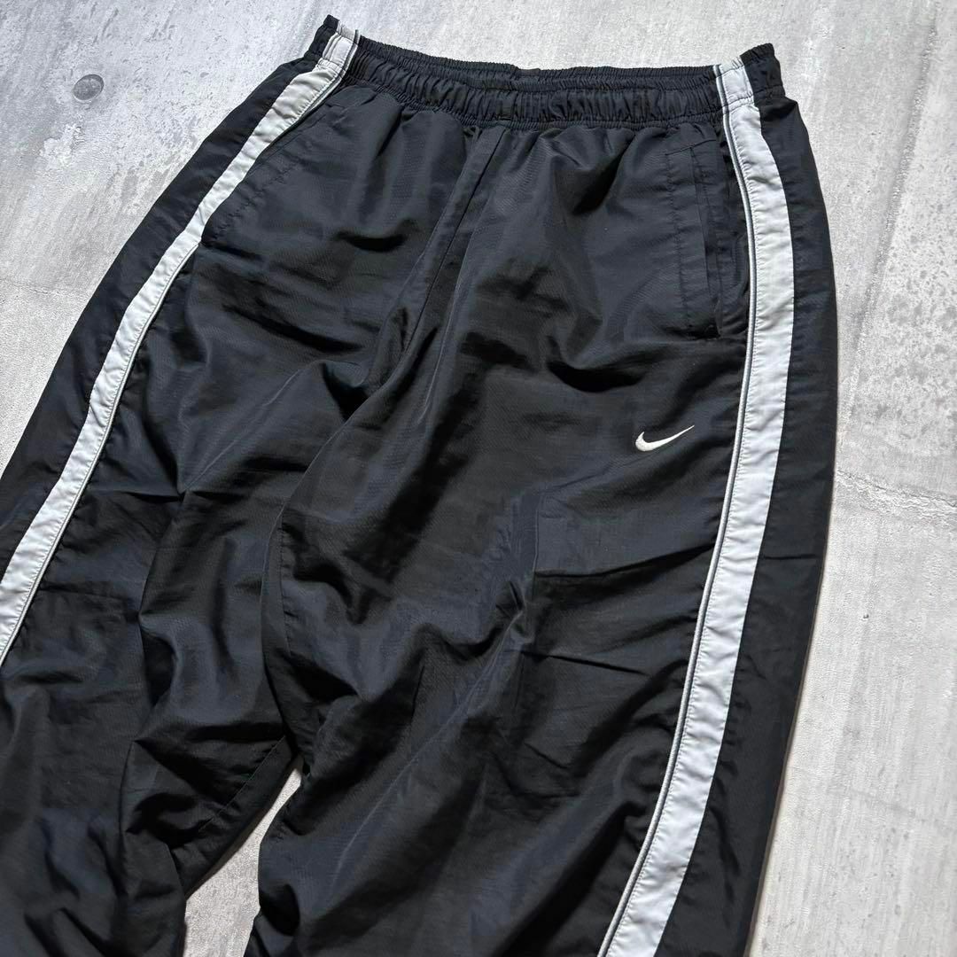 NIKE - y2k NIKE ナイロントラックパンツ サイドライン 裾ジップ NIKE - y2k NIKE ナイロントラックパンツ サイドライン 裾ジップ