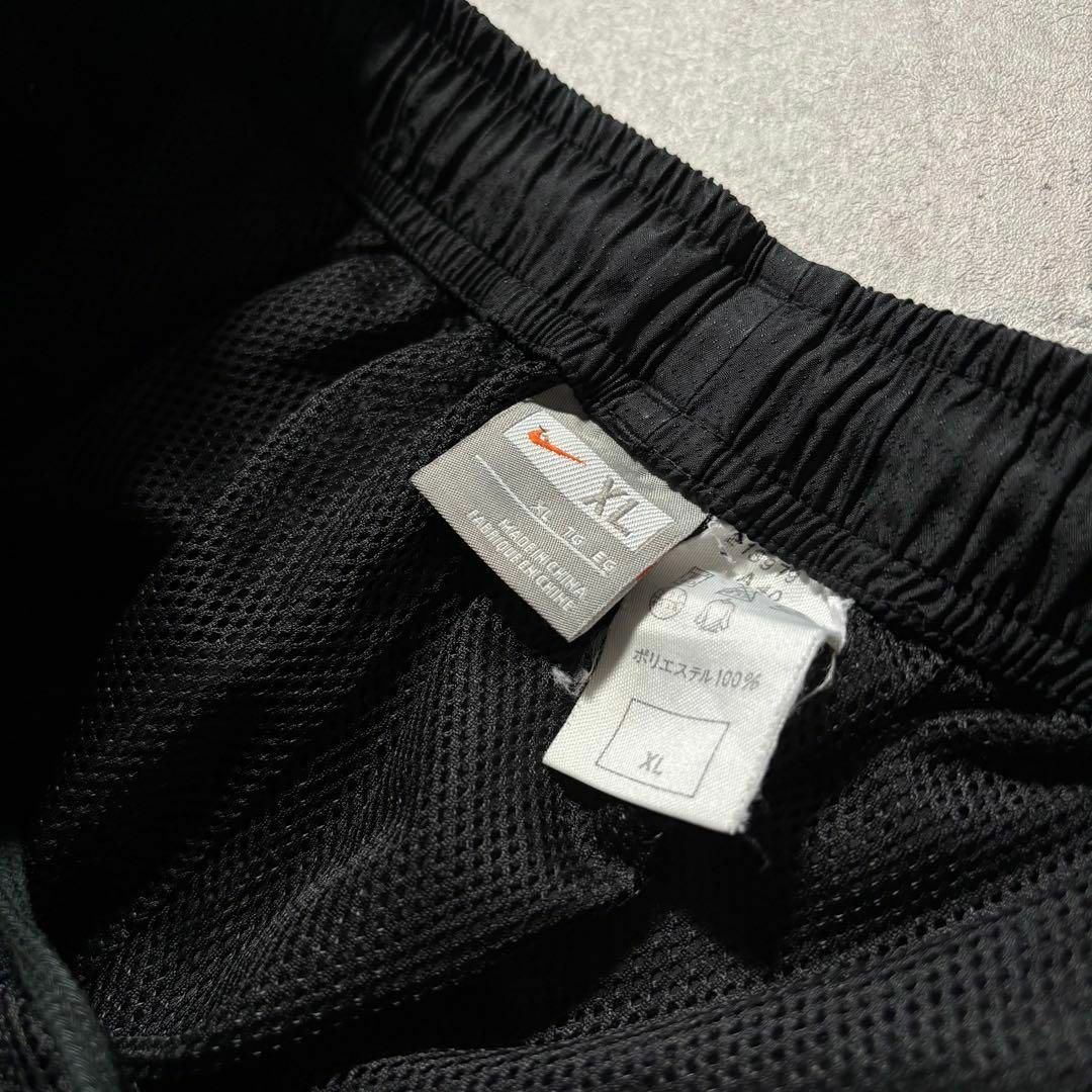 NIKE - y2k NIKE ナイロントラックパンツ サイドライン 裾ジップ NIKE - y2k NIKE ナイロントラックパンツ サイドライン 裾ジップ