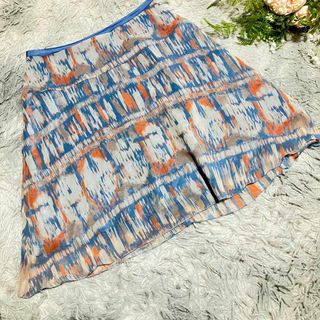インディヴィ(INDIVI)の【INDIVI】フレアシフォンスカート 青 オレンジ パターン　38 透け感(ミニスカート)