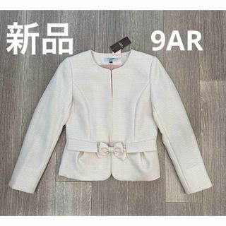 シマムラ(しまむら)のタグ付き新品着用品　ノーカラージャケット　リボン付き　オフホワイト　９AR(ノーカラージャケット)