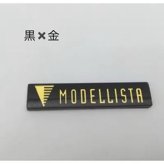 トヨタ(トヨタ)の《高品質》トヨタ モデリスタ MODELLSTA エンブレムステッカー 黒×金(車外アクセサリ)
