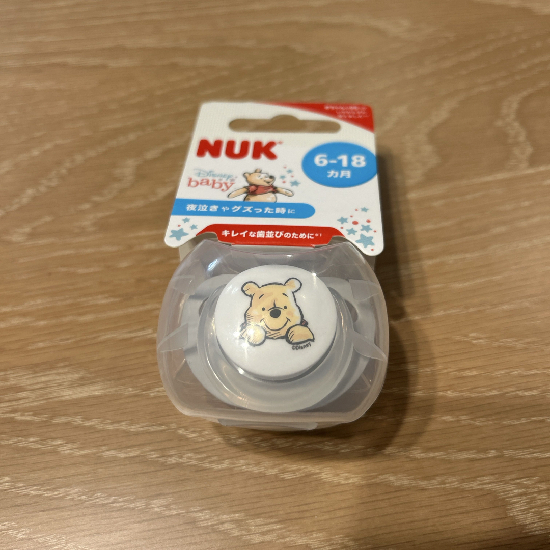 NUK おしゃぶり 6-18カ月用 くまのプーさん 白 キッズ/ベビー/マタニティのおもちゃ(その他)の商品写真