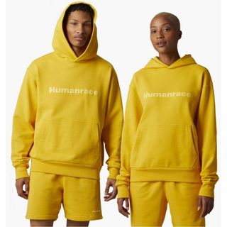 アディダス(adidas)のアディダス ファレルウィリアムス コラボ ベーシックパーカー イエロー Lサイズ(パーカー)