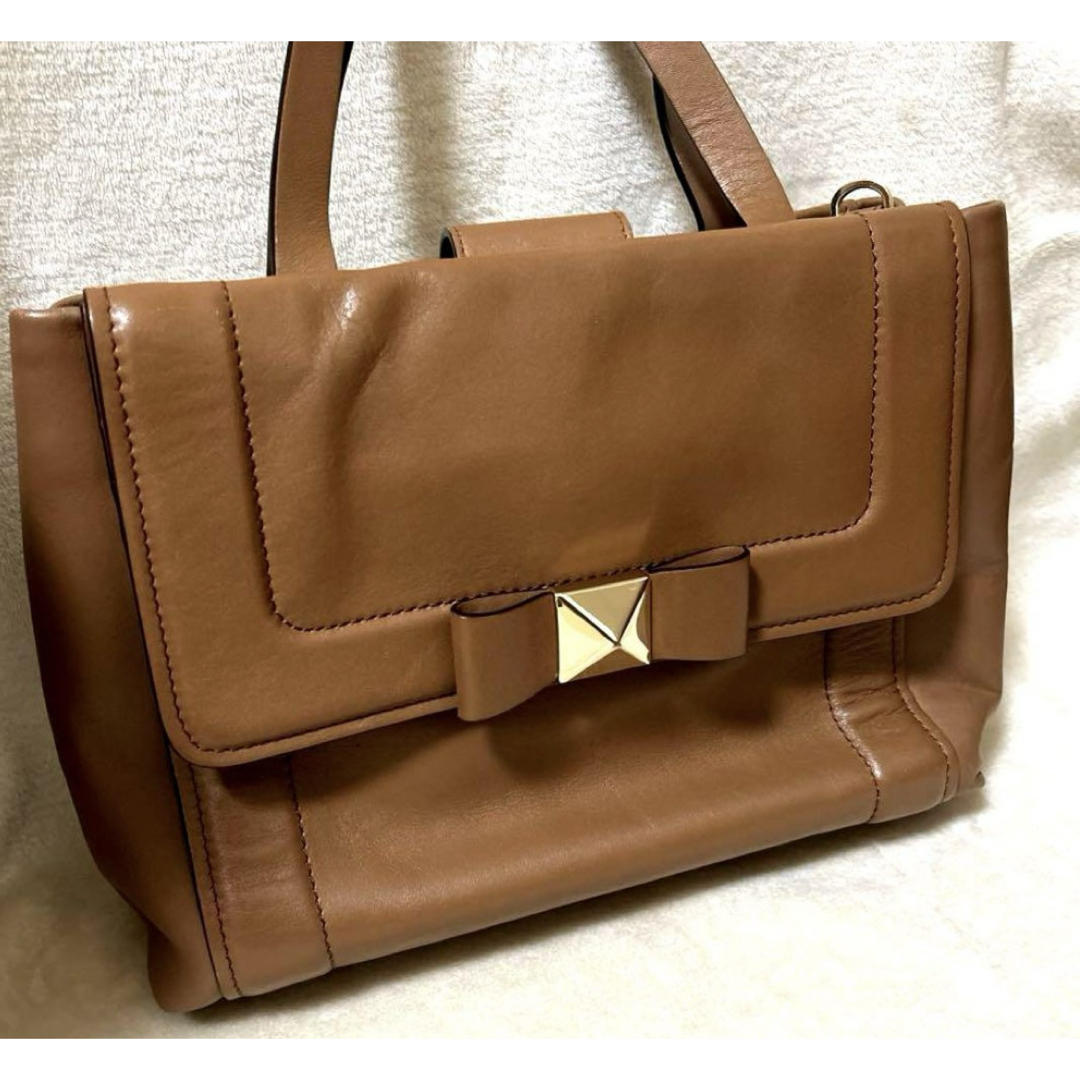 kate spade NEW YORK(ケイトスペードニューヨーク)のkate spade ケイトスペード レザーリボン ハンドバッグ キャメル レディースのバッグ(ハンドバッグ)の商品写真