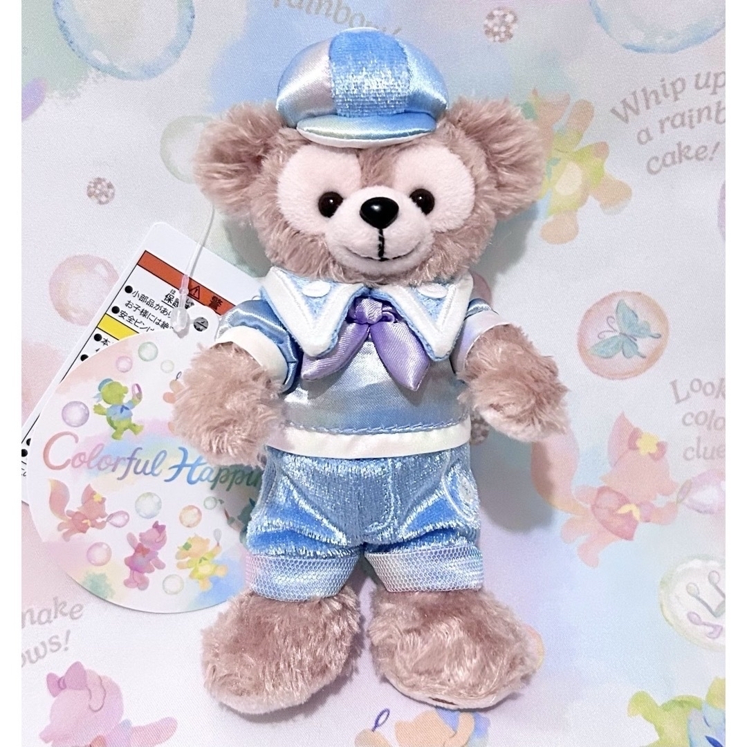 く日はお得♪ Disney - ダッフィー ぬいぐるみバッジ カラフルハピネス お顔 ぬいぐるみ