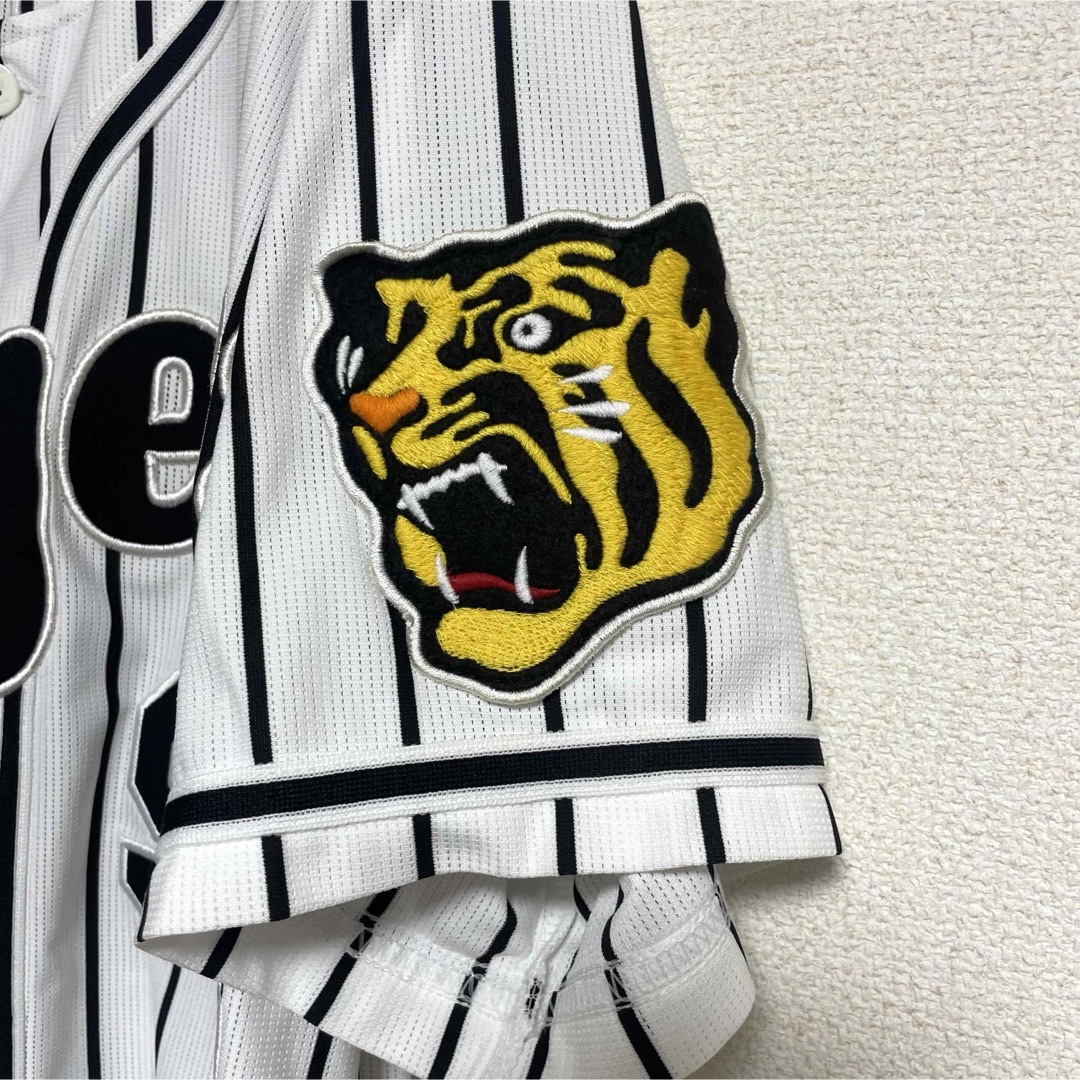 阪神タイガース(ハンシンタイガース)の阪神タイガース　ミズノ　レプリカユニフォーム　94    原口　旧ホーム　L スポーツ/アウトドアの野球(応援グッズ)の商品写真