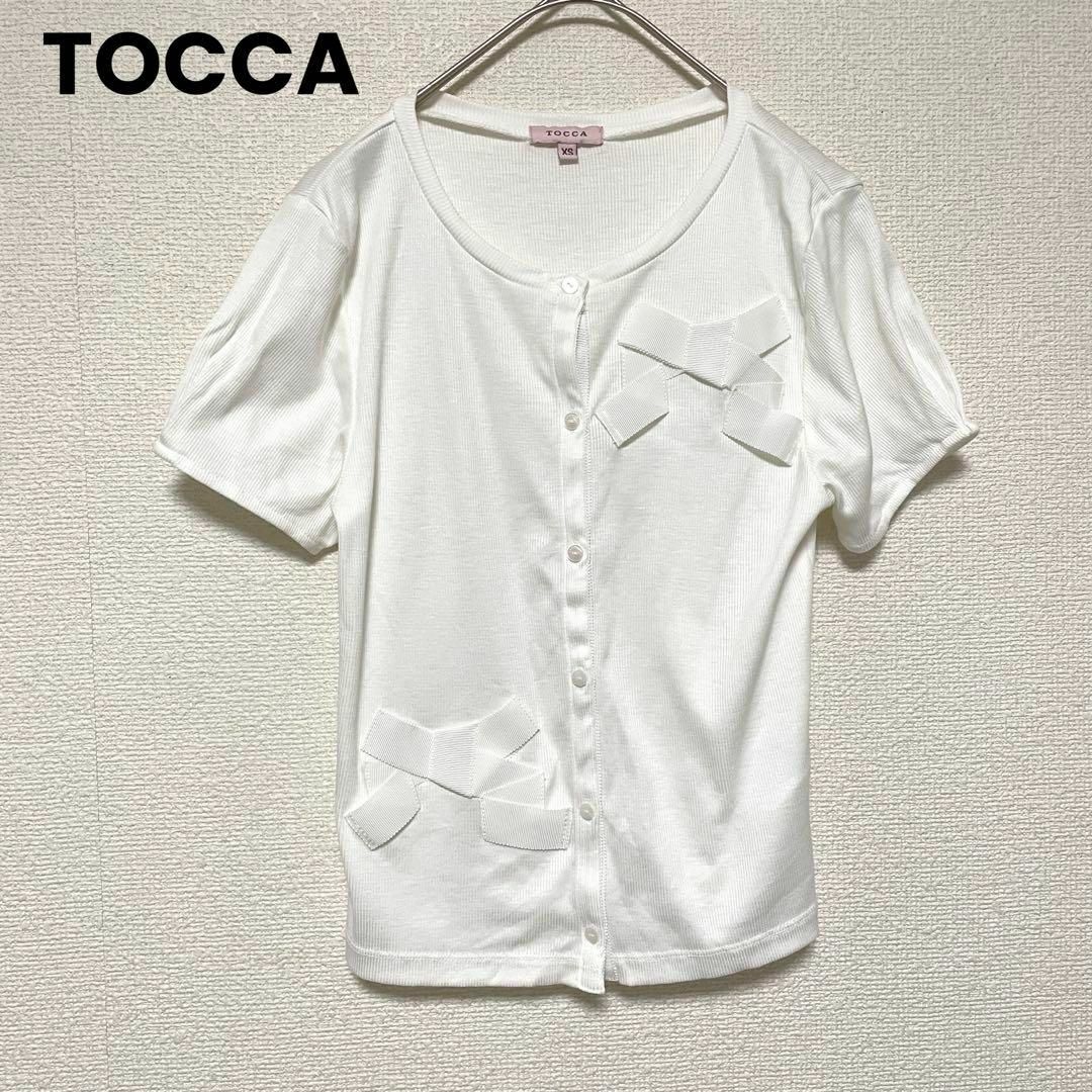 TOCCA(トッカ)のzo710 TOCCA/小さめリボンデザインカットソー/XS/半袖/ボタン/白 レディースのトップス(カットソー(半袖/袖なし))の商品写真