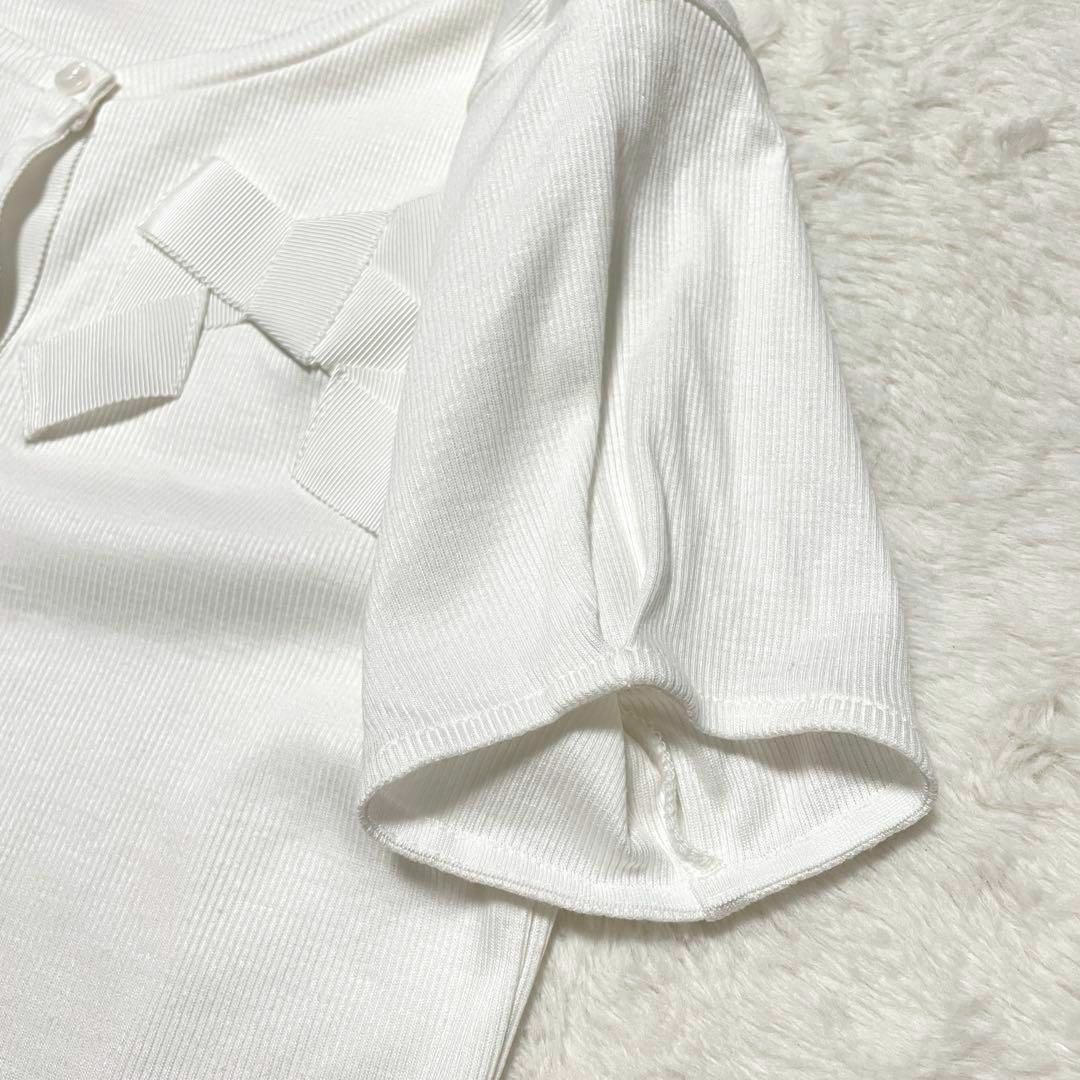 TOCCA(トッカ)のzo710 TOCCA/小さめリボンデザインカットソー/XS/半袖/ボタン/白 レディースのトップス(カットソー(半袖/袖なし))の商品写真