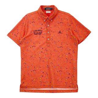 サイズ：L LE COQ GOLF ルコックゴルフ  半袖ポロシャツ ボタンダウン 総柄 オレンジ系 [240101491085] ゴルフウェア メンズ ストスト(ウエア)