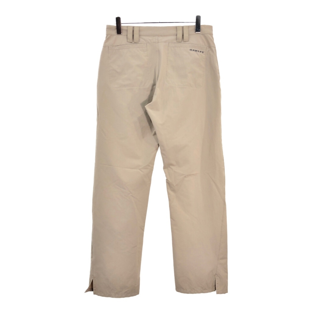 Oakley(オークリー)のOAKLEY オークリー ナイロンパンツ スポーツ ベージュ(メンズ W32 L32)中古 古着 V4707 メンズのパンツ(その他)の商品写真
