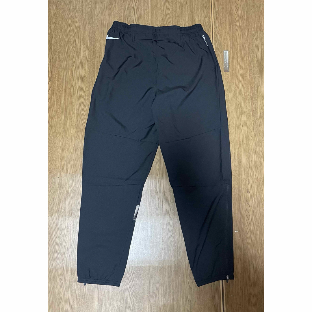 NIKE(ナイキ)の新品未使用　ナイキ メンズ ウーブン ランニングパンツ　2XLサイズ スポーツ/アウトドアのトレーニング/エクササイズ(トレーニング用品)の商品写真