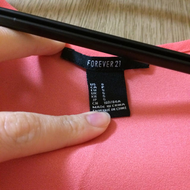 FOREVER 21(フォーエバートゥエンティーワン)のFOROEVER 21 オレンジタンク レディースのトップス(Tシャツ(長袖/七分))の商品写真