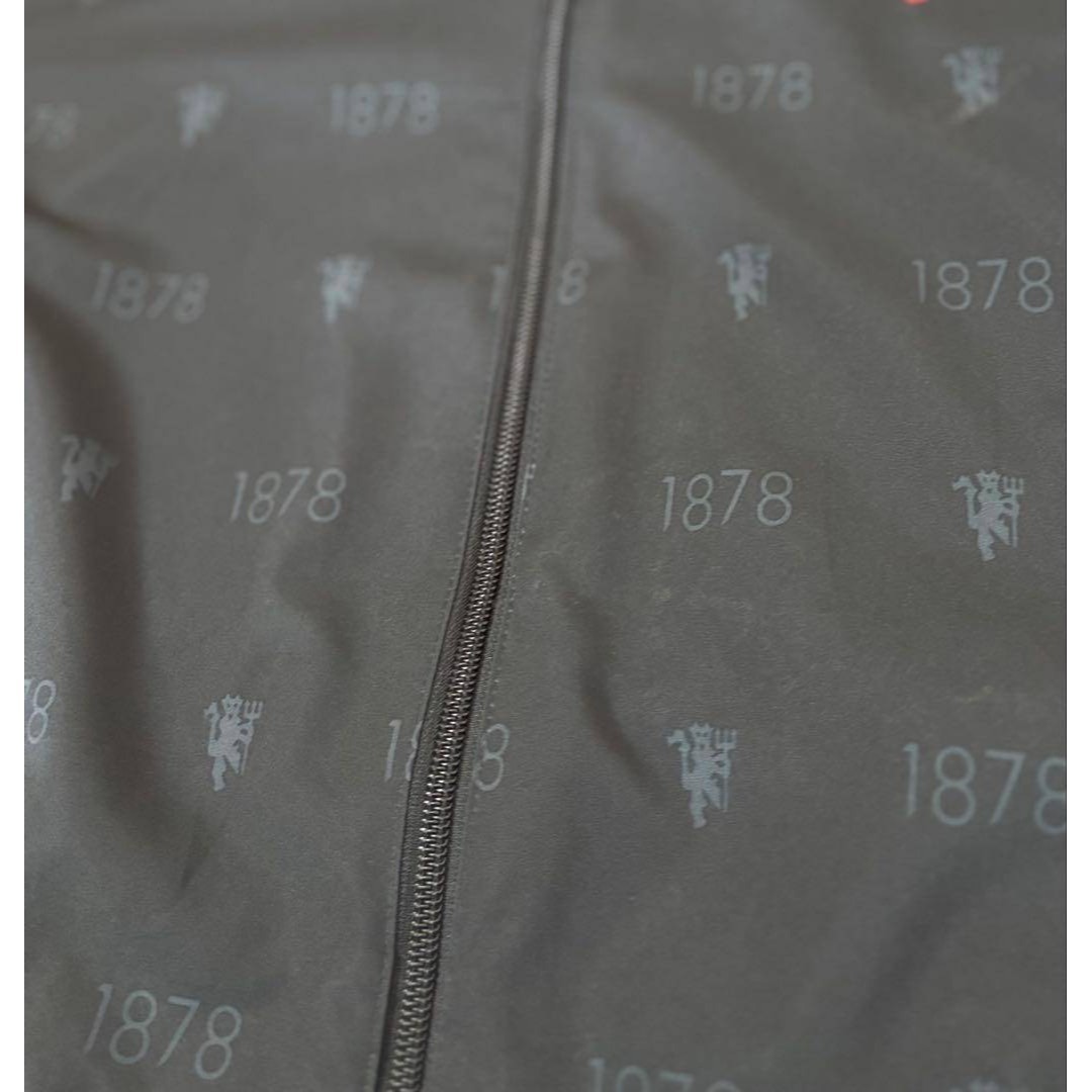 adidas(アディダス)のadidas マンチェスター・ユナイテッド　刺繍　総柄　ナイロンジャケット メンズのジャケット/アウター(ナイロンジャケット)の商品写真