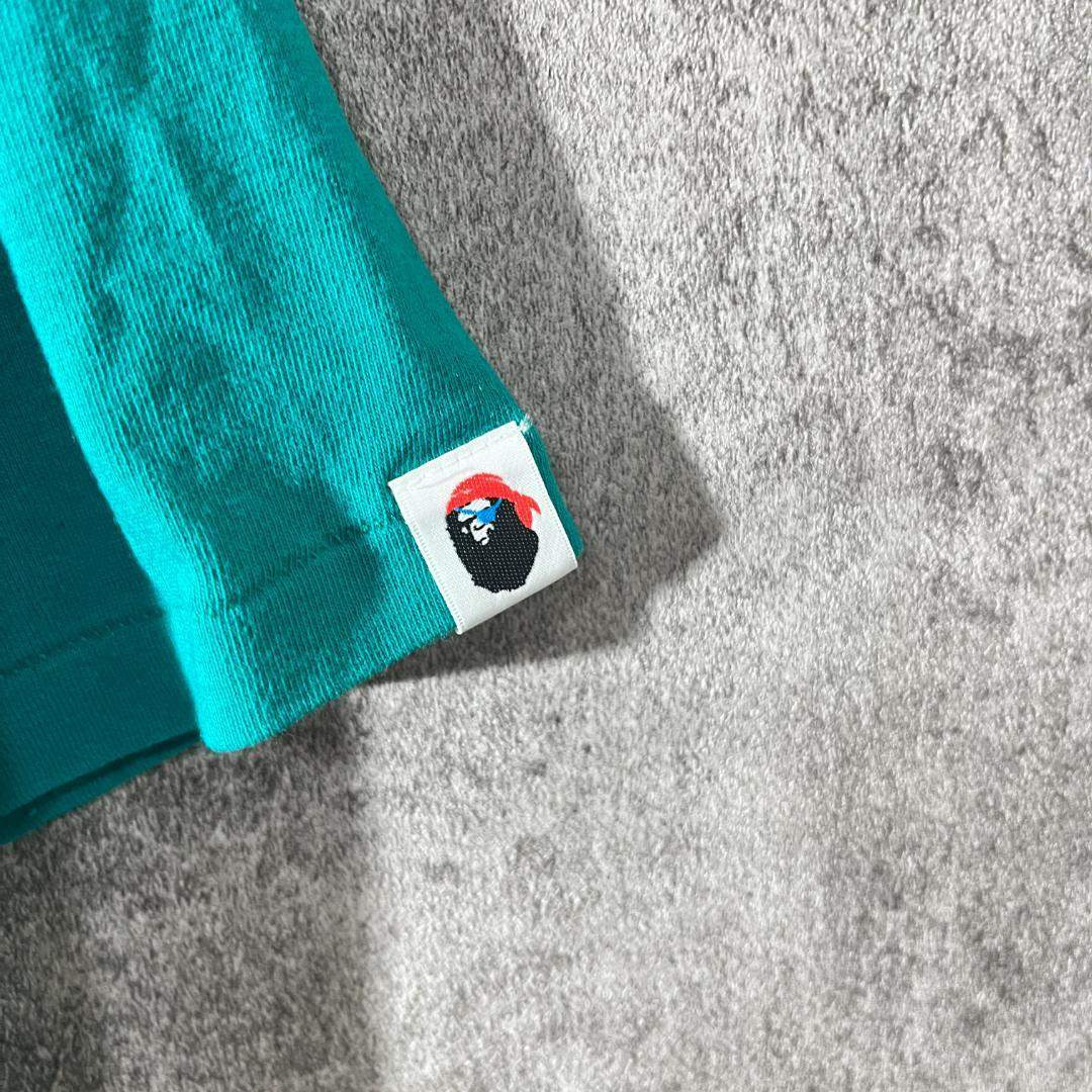 A BATHING APE(アベイシングエイプ)の[大人気]　アベイシングエイプ　Tシャツ　カレッジロゴ　パイレーツ　大猿　美品 メンズのトップス(Tシャツ/カットソー(七分/長袖))の商品写真