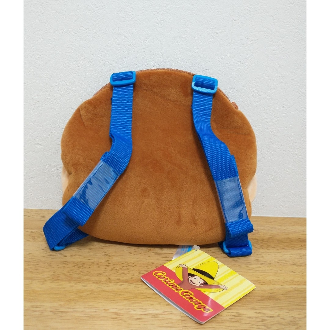【新品・タグ付き】おさるのジョージ　プラチナムザッカフェイスリュック　青　ブルー エンタメ/ホビーのおもちゃ/ぬいぐるみ(その他)の商品写真