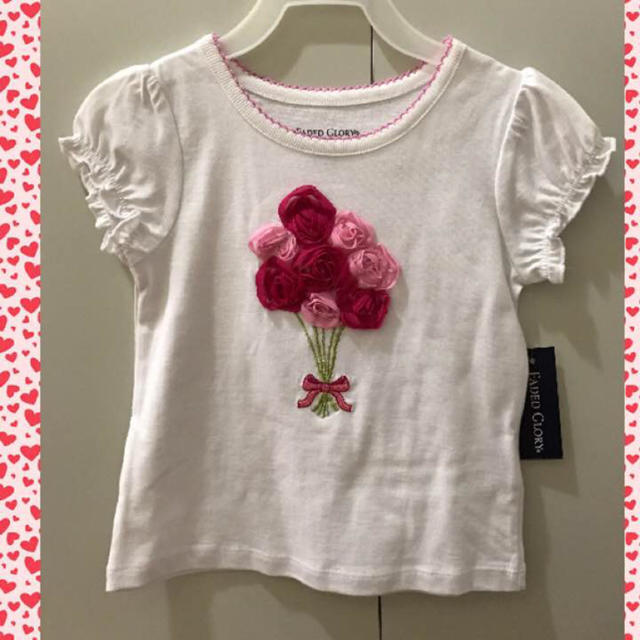 JILLSTUART NEWYORK(ジルスチュアートニューヨーク)のハワイで購入 ピンク立体フラワーブーケ ホワイトTシャツ 女の子 キッズ/ベビー/マタニティのキッズ服女の子用(90cm~)(Tシャツ/カットソー)の商品写真