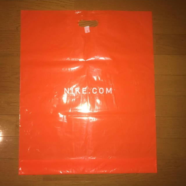 NIKE(ナイキ)のNike ショップバッグ オレンジ NIKE.COM レディースのバッグ(ショップ袋)の商品写真