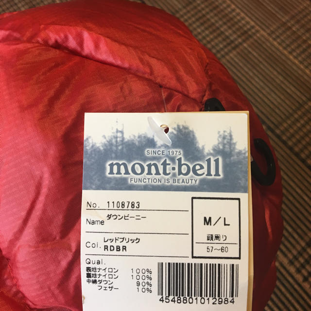 mont bell(モンベル)の新品未使用 モンベル ダウンビーニー M /L スポーツ/アウトドアのアウトドア(登山用品)の商品写真